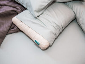 WakeWell Pillow on bed